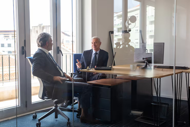 Two executives shaking hands